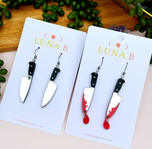 Silver mirror acrylic earrings shaped like chef knives, laser-cut with stainless steel ear wires, perfect for foodies and culinary lovers.