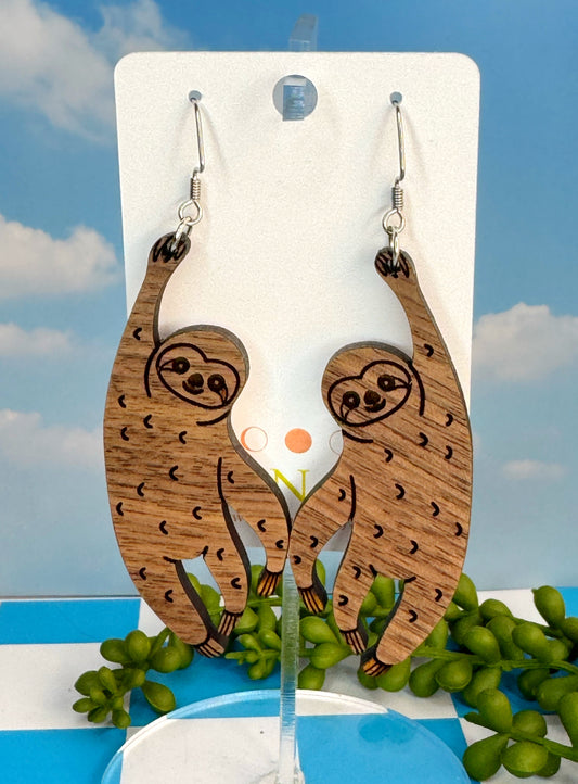 Cute sloth-shaped wooden earrings made from sustainable hardwood with stainless steel ear wires, handcrafted for animal lovers.”