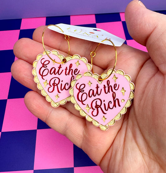 Eat the Rich statement earrings, laser-cut and hand-painted acrylic with nickel-free hoops, bold political jewelry for protest fashion.