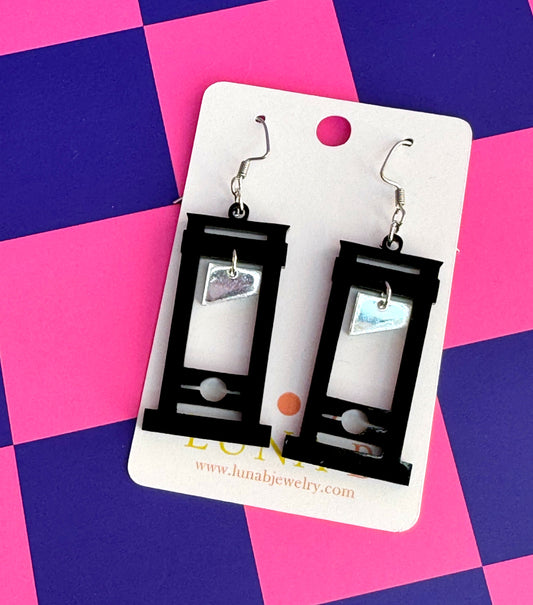 Tiny guillotine-shaped acrylic earrings with stainless steel ear wires, handmade statement jewelry with revolutionary flair.