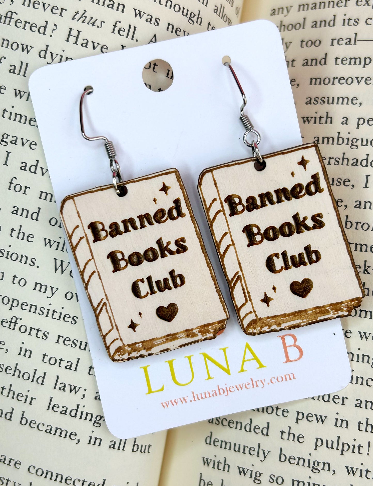 Banned Books Club earrings made from sustainable birch wood with bold laser-cut lettering, perfect for book lovers and free speech advocates.