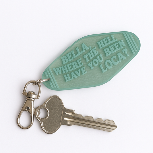Green retro motel-style keychain with engraved text reading ‘Bella, where the hell have you been, loca?’ attached to a key and lobster clasp, handmade at Luna B Studios.