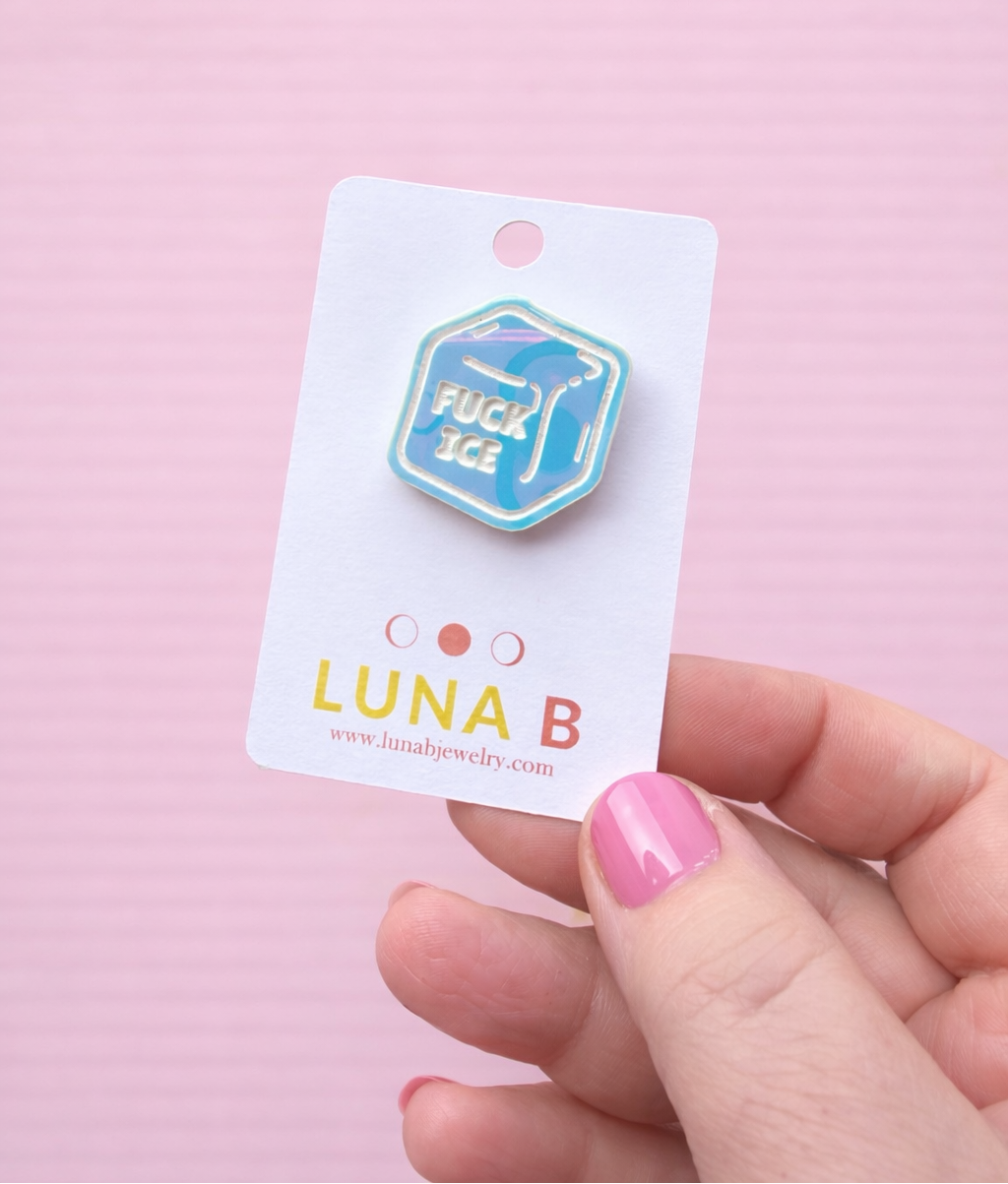 Pin with 'LUNA B' branding on a pink background