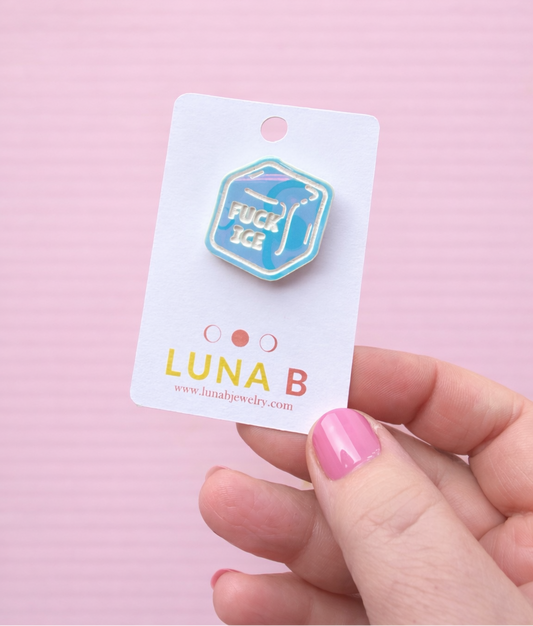 Pin with 'LUNA B' branding on a pink background